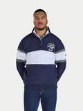 Man wearing a navy and white striped sweater with a logo on a white background