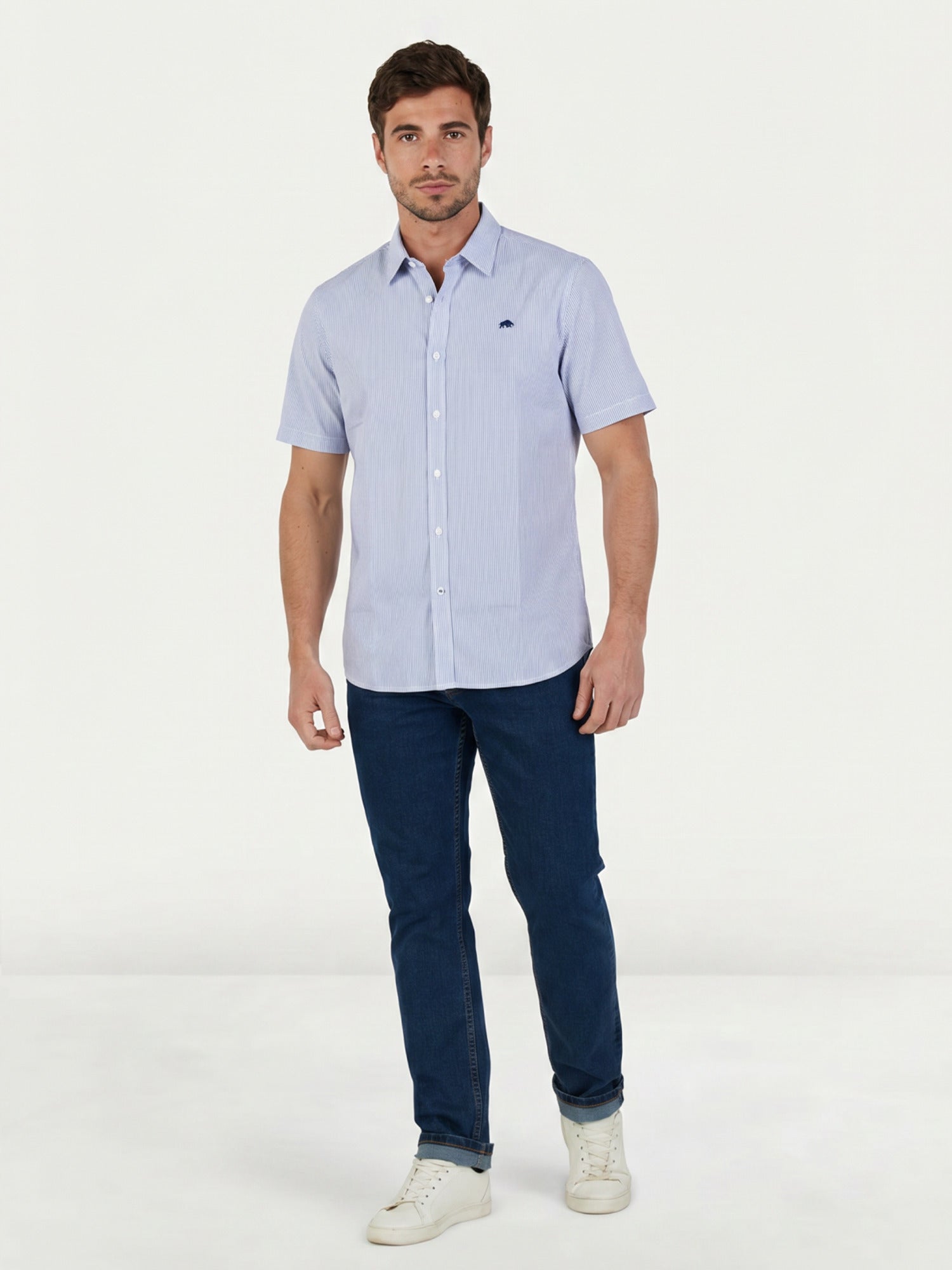 Man wearing Raging Bull Orleans Seersucker Stripe Short Sleeve Shirt in Navy and Regular Fit Jeans in Denim, available in sizes S-6XL.