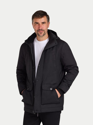 Man wearing a black jacket on a white background