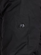 Black shirt with a small bear emblem on the chest.