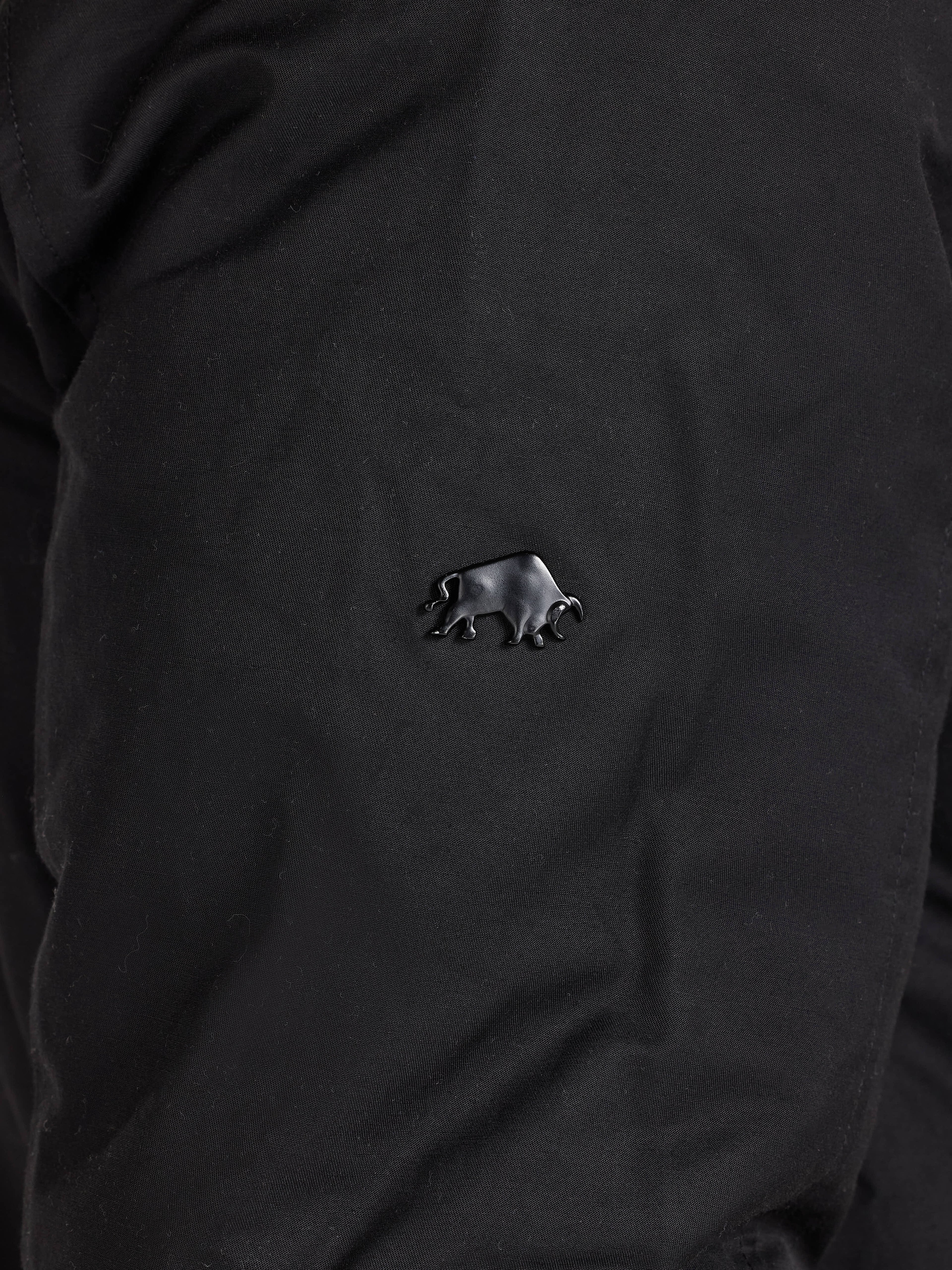 Black shirt with a small bear emblem on the chest.