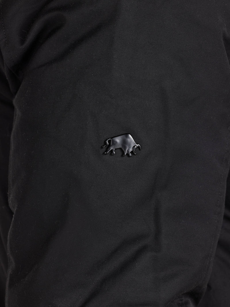 Black shirt with a small bear emblem on the chest.