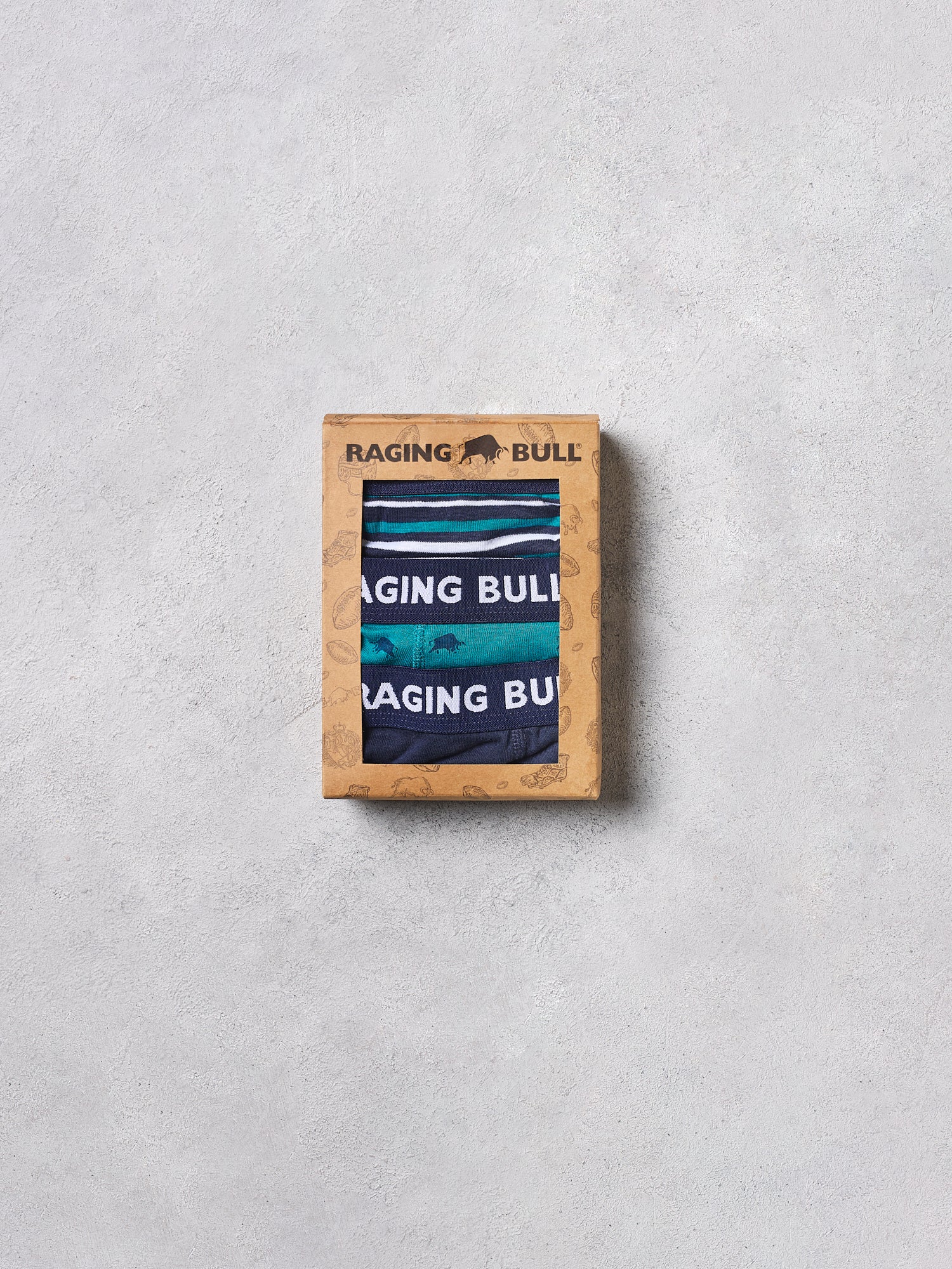 Raging Bull branded box with striped fabric on a gray background
