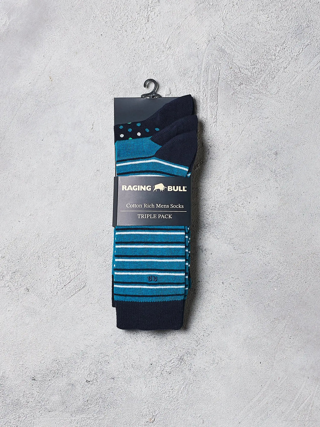 Pack of Raging Bull men's socks with blue and black stripes on a gray background