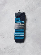 Pack of Raging Bull men's socks with blue and black stripes on a gray background