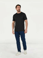 Man wearing Raging Bull Classic Organic t-shirt in black and Regular Fit Jeans in Denim. 