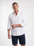 Man wearing Raging Bull linen shirt in white, front. 