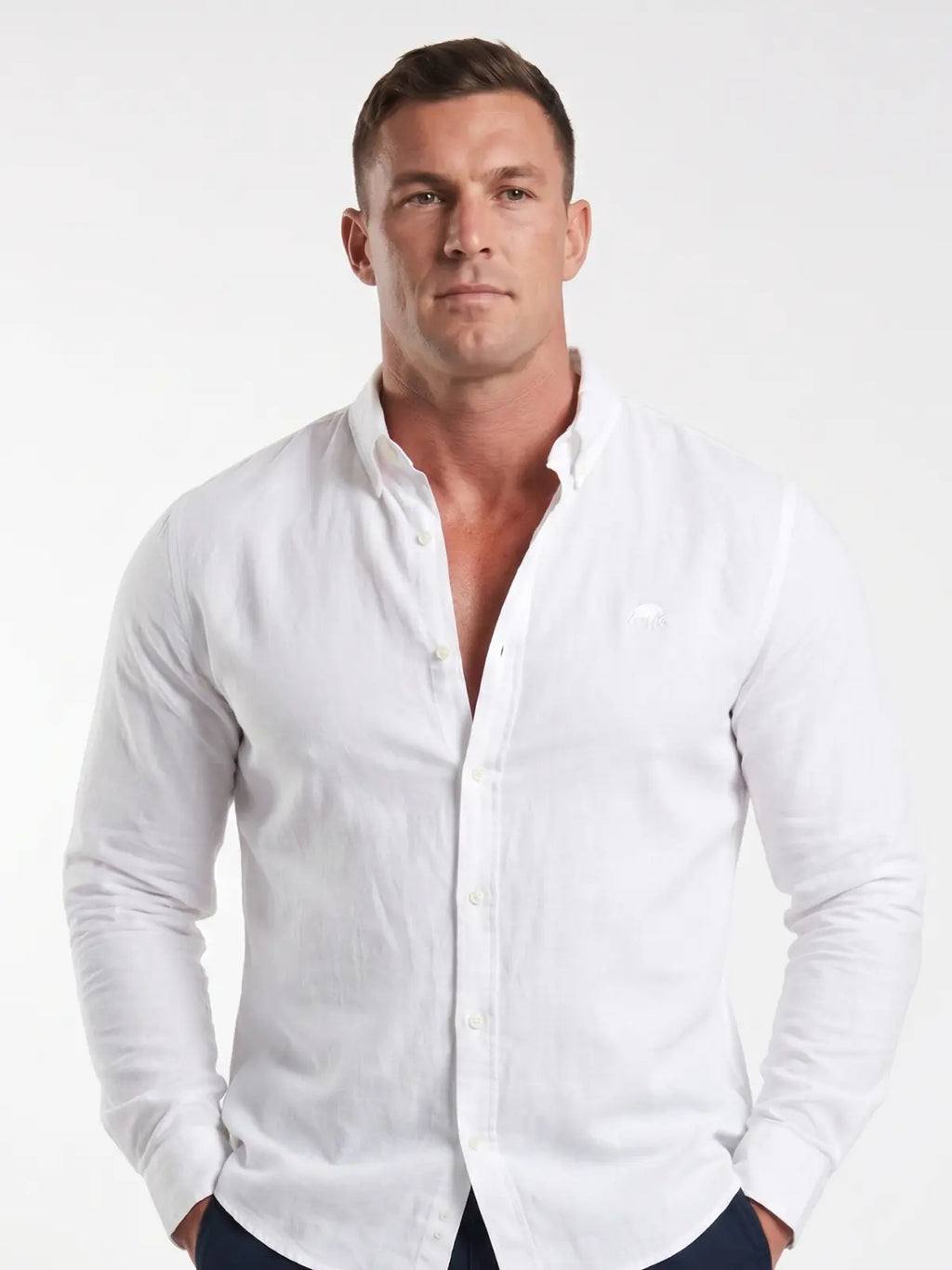 Man wearing Raging Bull linen shirt in white, front detail. 