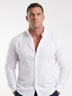 Man wearing Raging Bull linen shirt in white, front detail. 