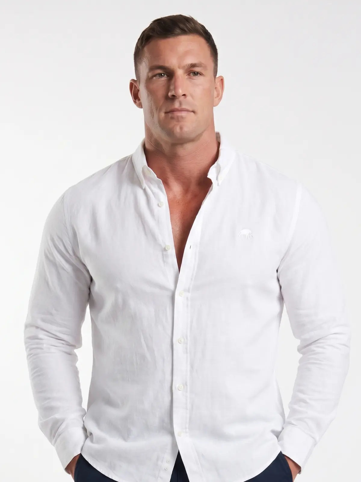 Man wearing Raging Bull linen shirt in white, front detail. 