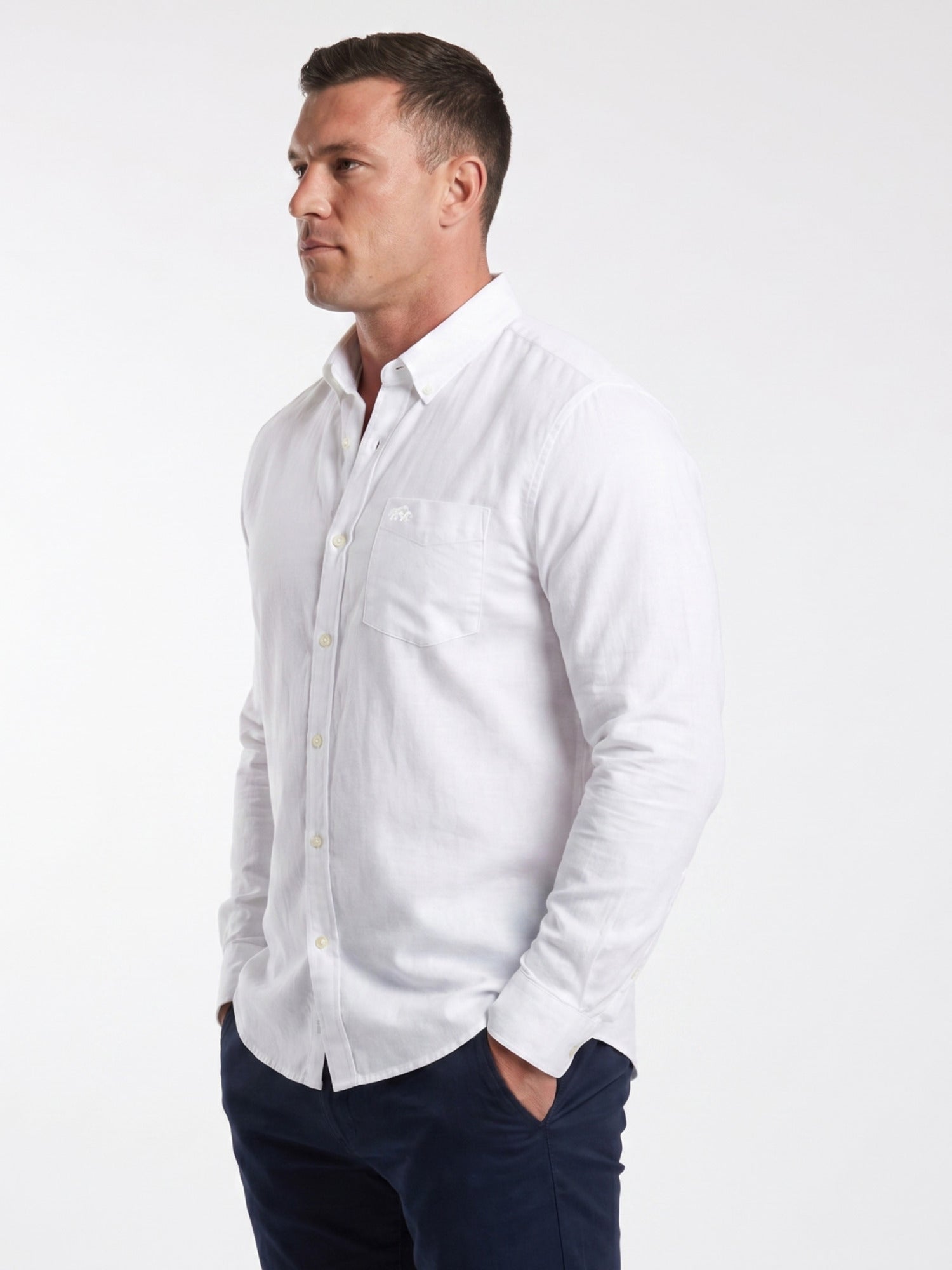 Man wearing Raging Bull Linen Look Long Sleeve Shirt in White and Classic Chino Shorts in Navy, available in sizes S-6XL