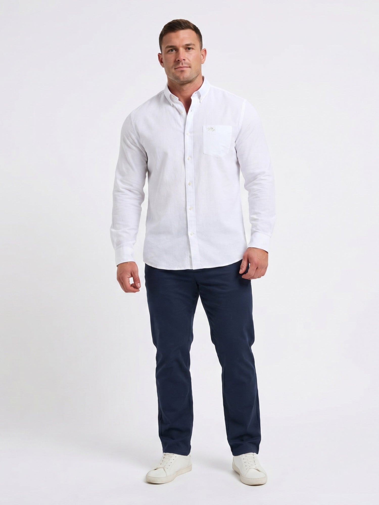 Man wearing Raging Bull Linen Look Long Sleeve Shirt in White and Classic Chino Shorts in Navy, available in sizes S-6XL, front.