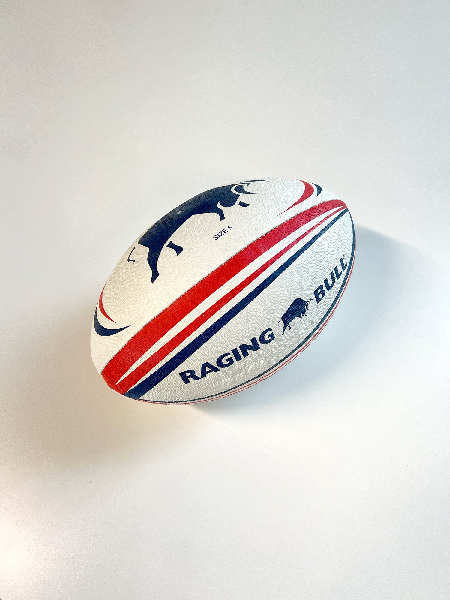 Raging Bull white rugby ball on white backround