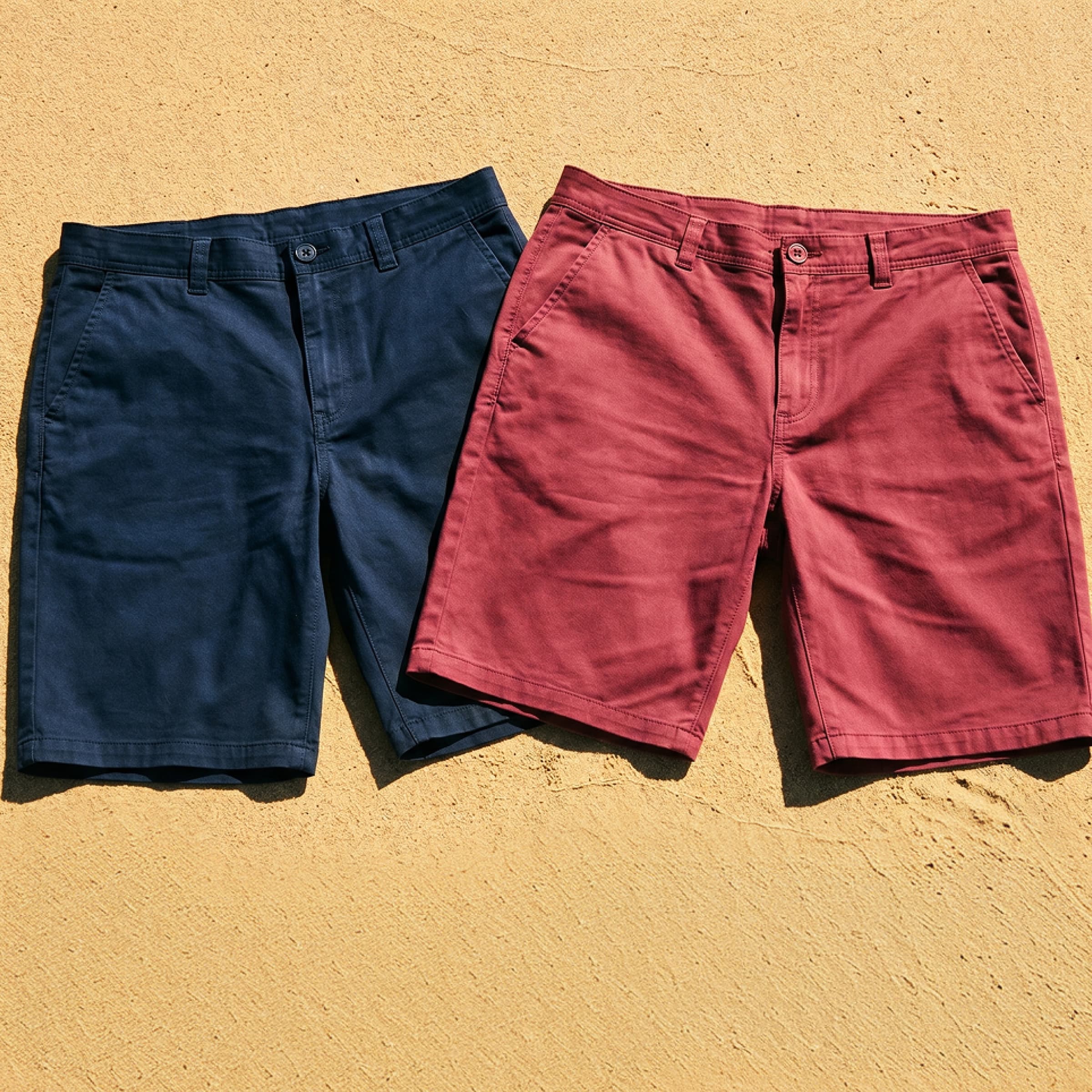Raging Bull Summer Chino Shorts in navy and berry on a sandy beach. 