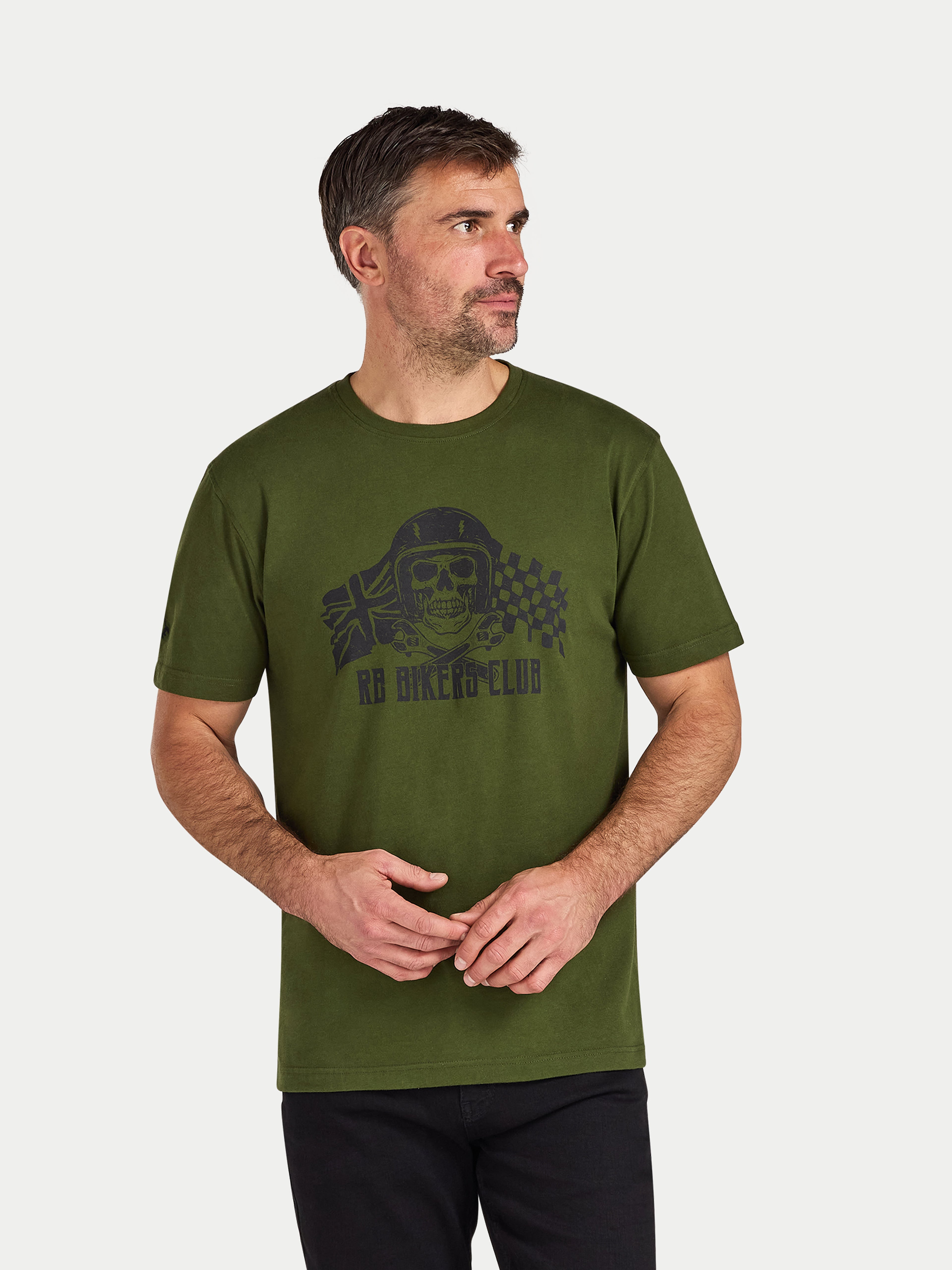 Man wearing a green t-shirt with a graphic design on a white background