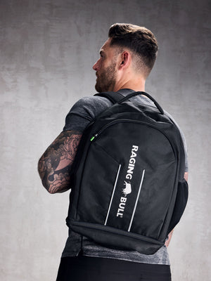 Man carrying a black Raging Bull rucksack