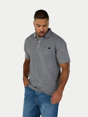 Man wearing a gray polo shirt with a logo on a white background
