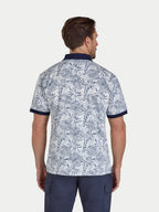 Man wearing a patterned polo shirt on a white background