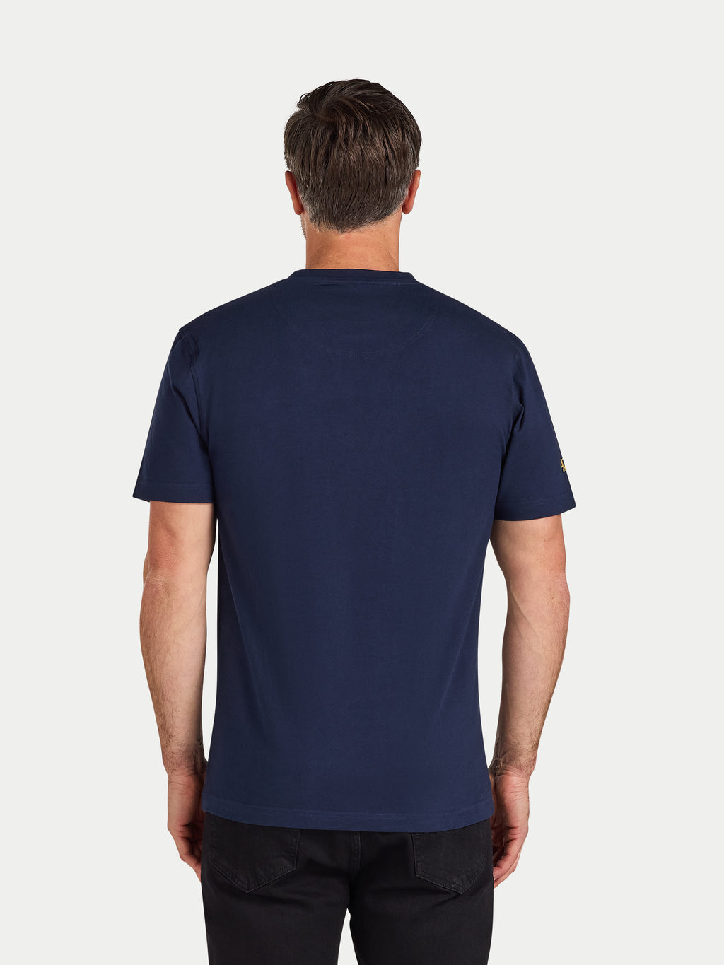 Man wearing a navy blue t-shirt on a white background