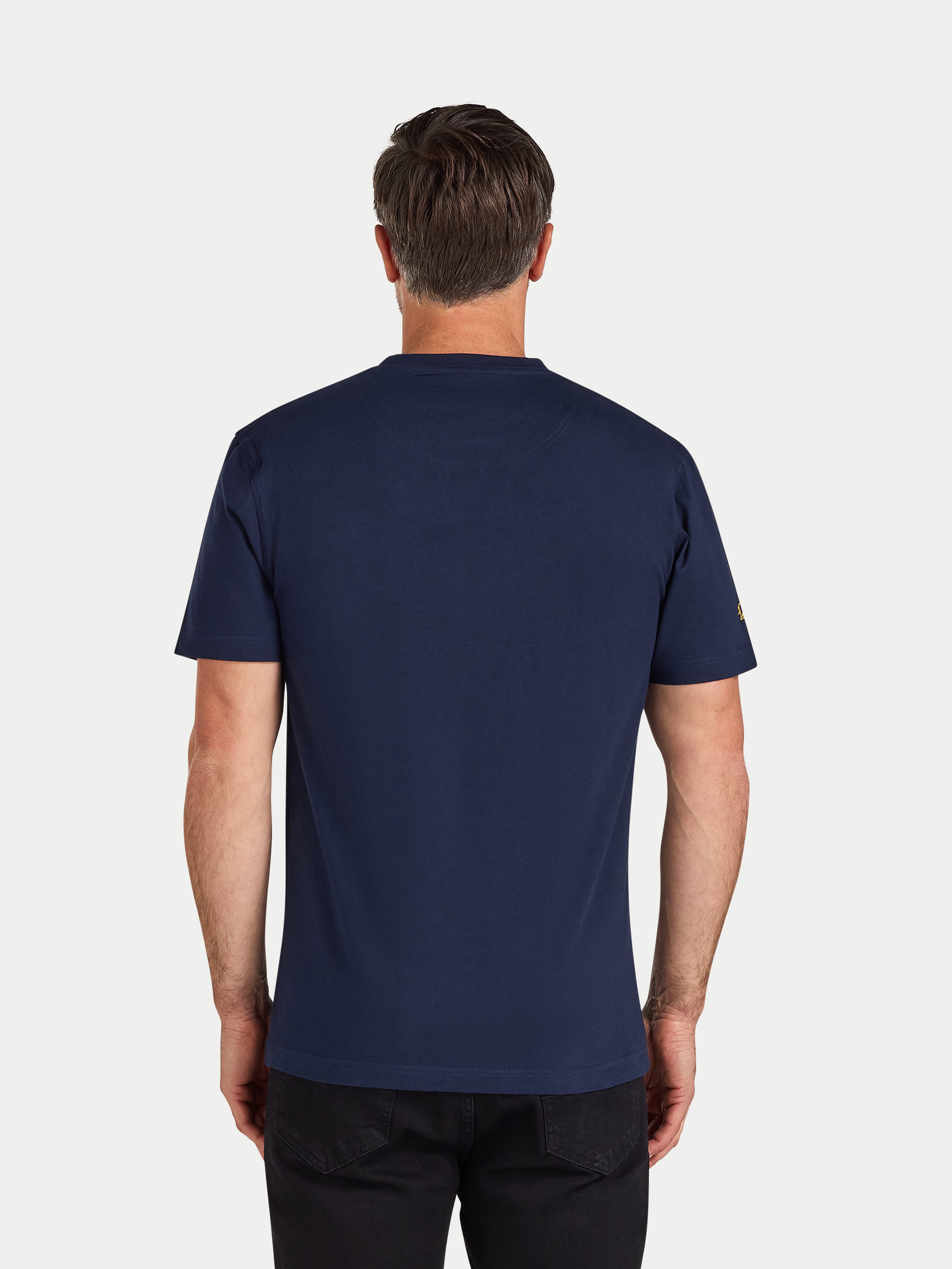 Man wearing a navy blue t-shirt on a white background