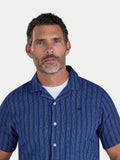 Man wearing Raging Bull Athens Stripe Linen Revere Short Sleeve Shirt in Navy, available in sizes S-6XL.