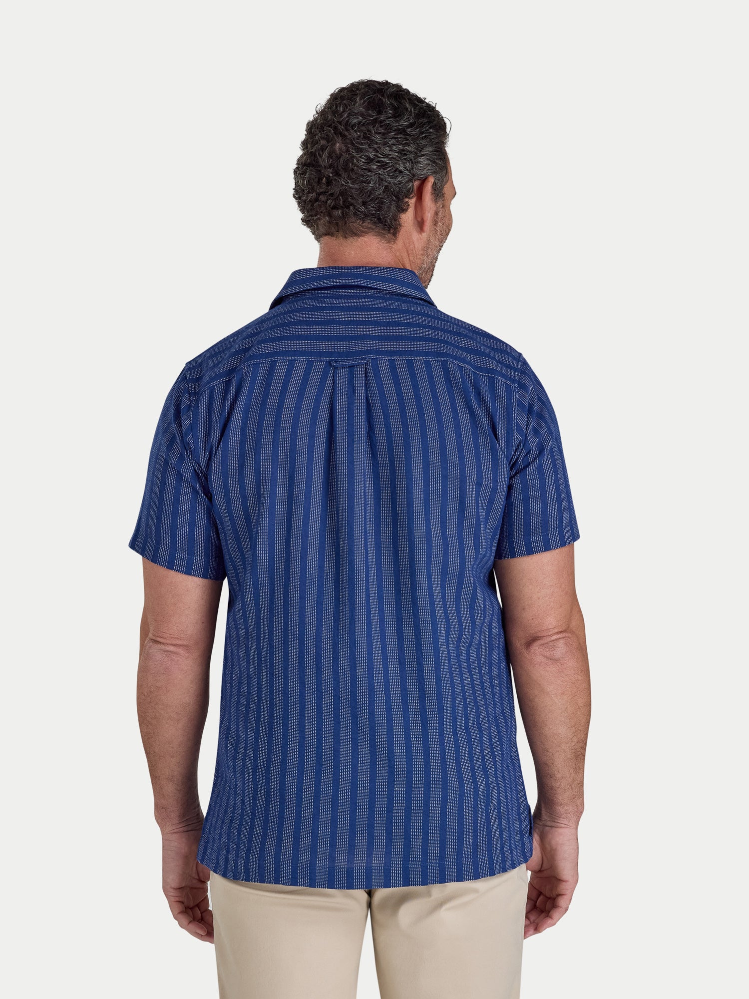 Man wearing Raging Bull Athens Stripe Linen Revere Short Sleeve Shirt in Navy, available in sizes S-6XL.