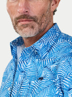 Man wearing Raging Bull Bali Palm Linen Short Sleeve Shirt in Sky Blue, collar detail, available in sizes S-6XL.