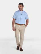 Man wearing Raging Bull Bournemouth Stripe Linen Short Sleeve Shirt in Sky Blue  and Classic Chino Trousers in tan, available in sizes S-6XL.