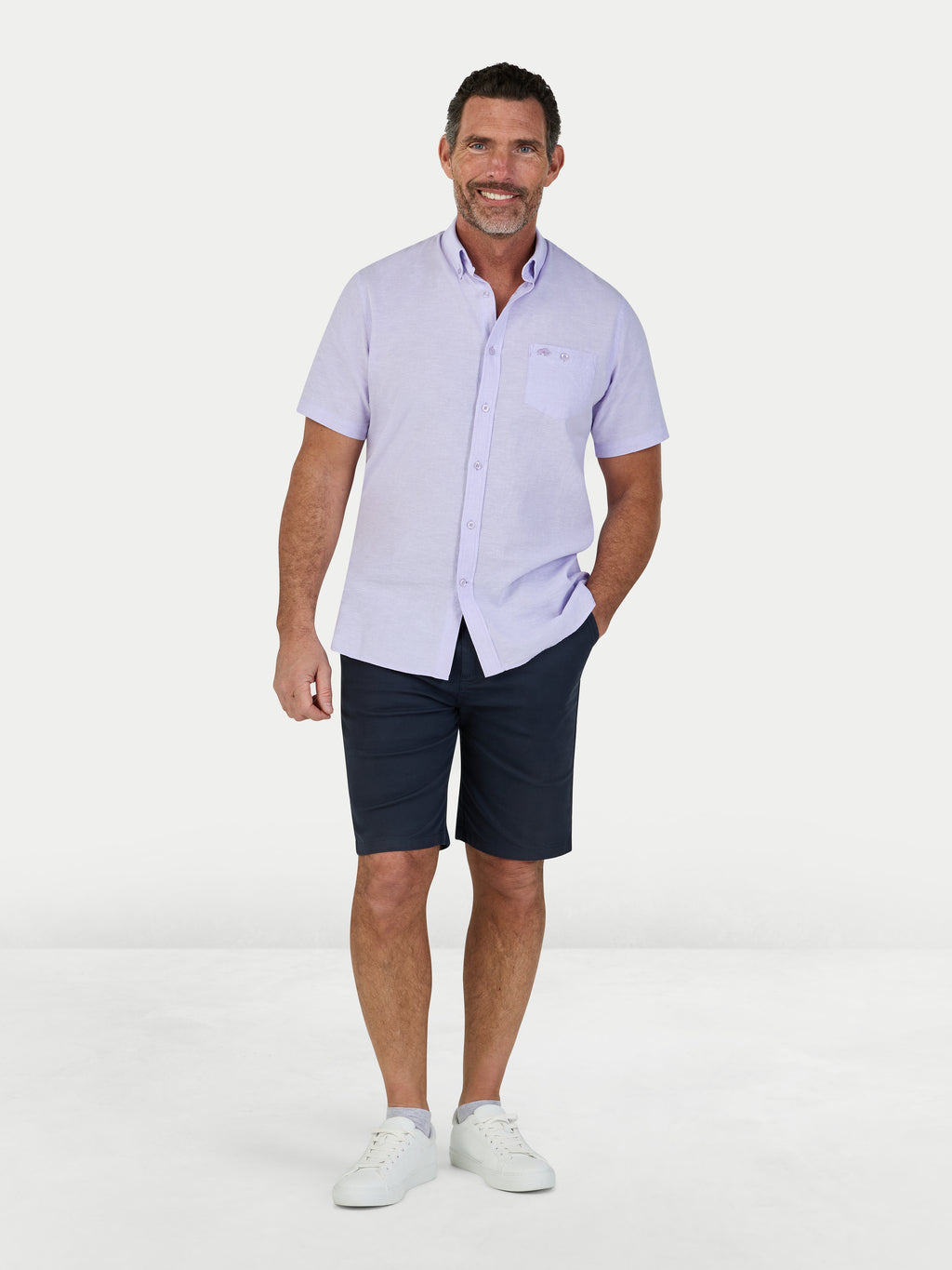 Man wearing Raging Bull Classic Linen Short Sleeve Shirt in Lilac and Classic Chino shorts in navy, available in sizes S-6XL.
