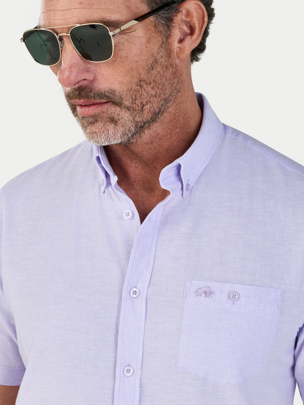 Man wearing Raging Bull Classic Linen Short Sleeve Shirt in Lilac, chest and collar detail, available in sizes S-6XL.