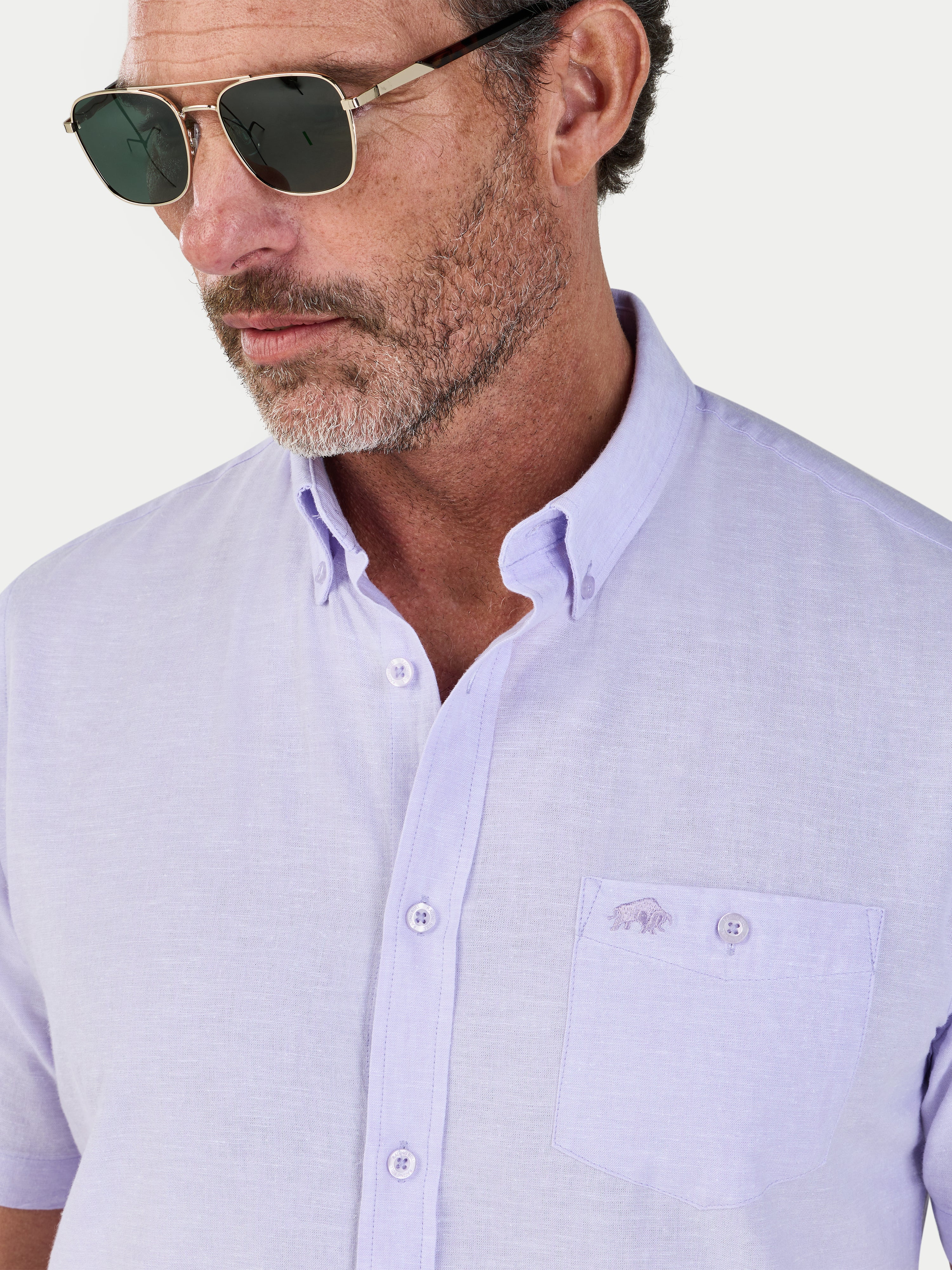 Man wearing Raging Bull Classic Linen Short Sleeve Shirt in Lilac, chest and collar detail, available in sizes S-6XL.