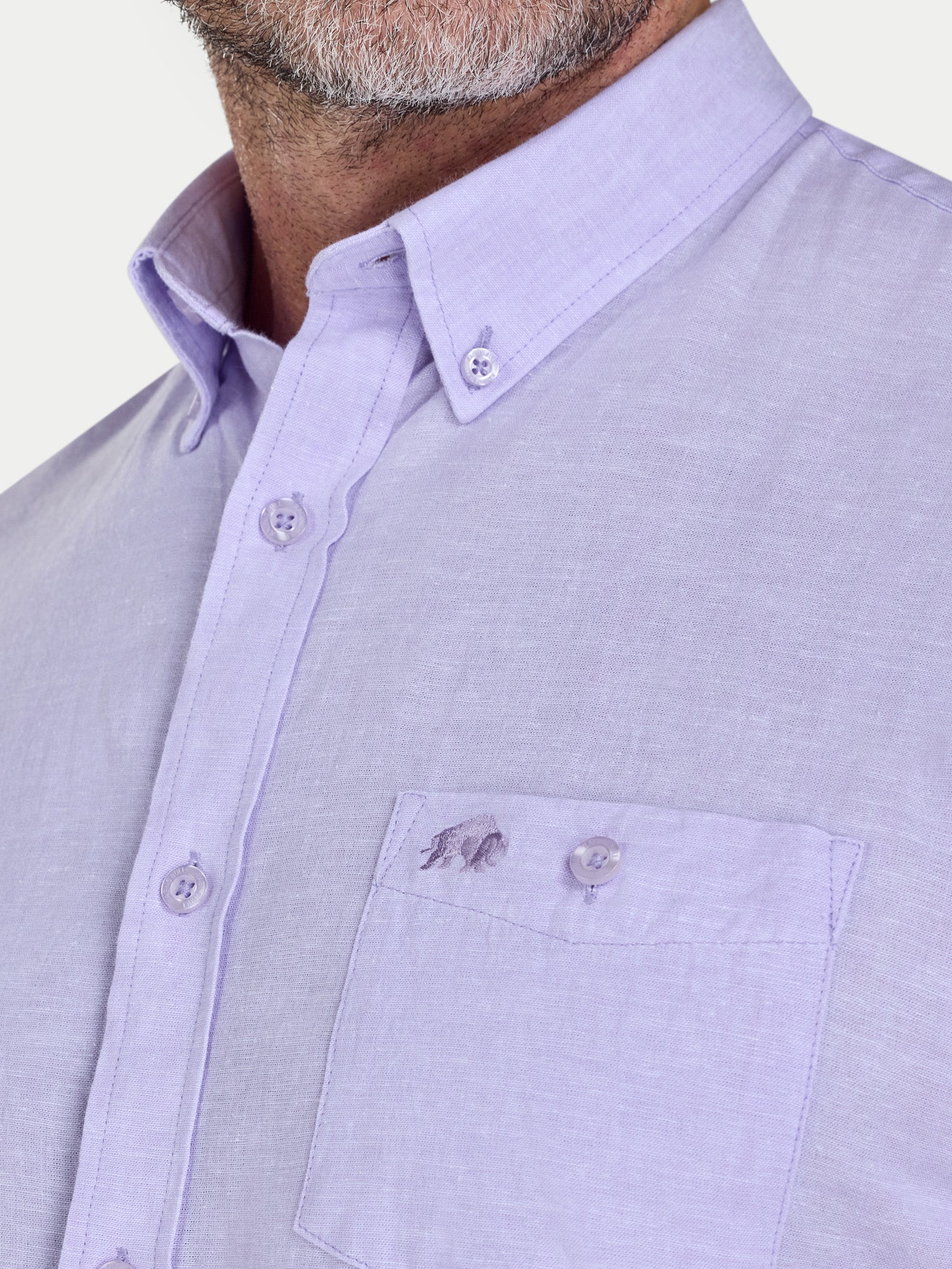 Man wearing Raging Bull Classic Linen Short Sleeve Shirt in Lilac, chest pocket and collar detail, available in sizes S-6XL.
