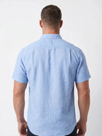 Man wearing Raging Bull short sleeve classic linen shirt in sky blue, back. 