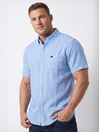 Man wearing Raging Bull short sleeve classic linen shirt in sky blue, front. 