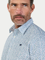 Man wearing Raging Bull Floral Cotton Poplin Short Sleeve Shirt in Sky Blue, available in sizes S-6XL.