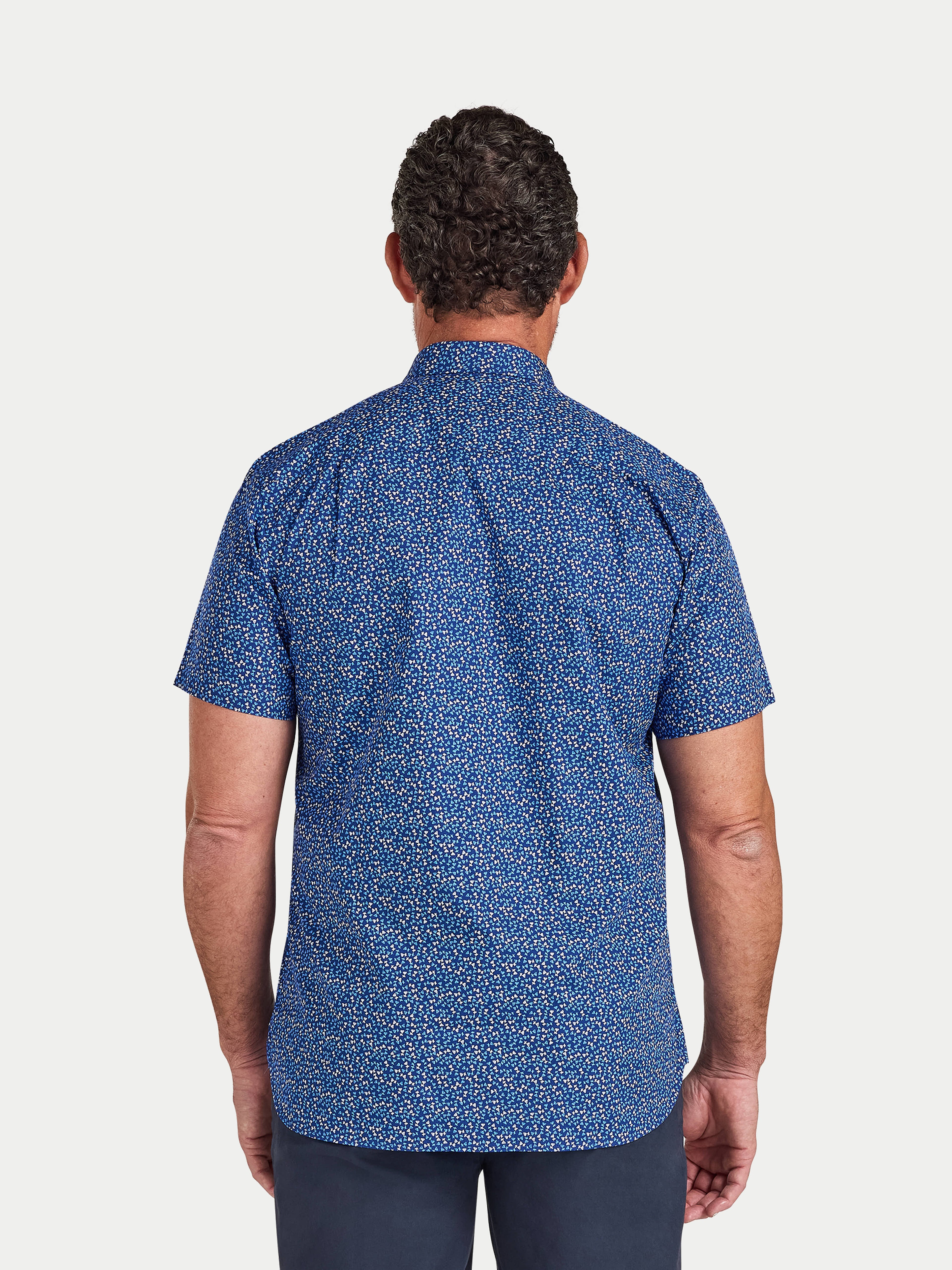 Man wearing Raging Bull Flower Bud Cotton Poplin Short Sleeve Shirt in Navy, back detail, available in sizes S-6XL.