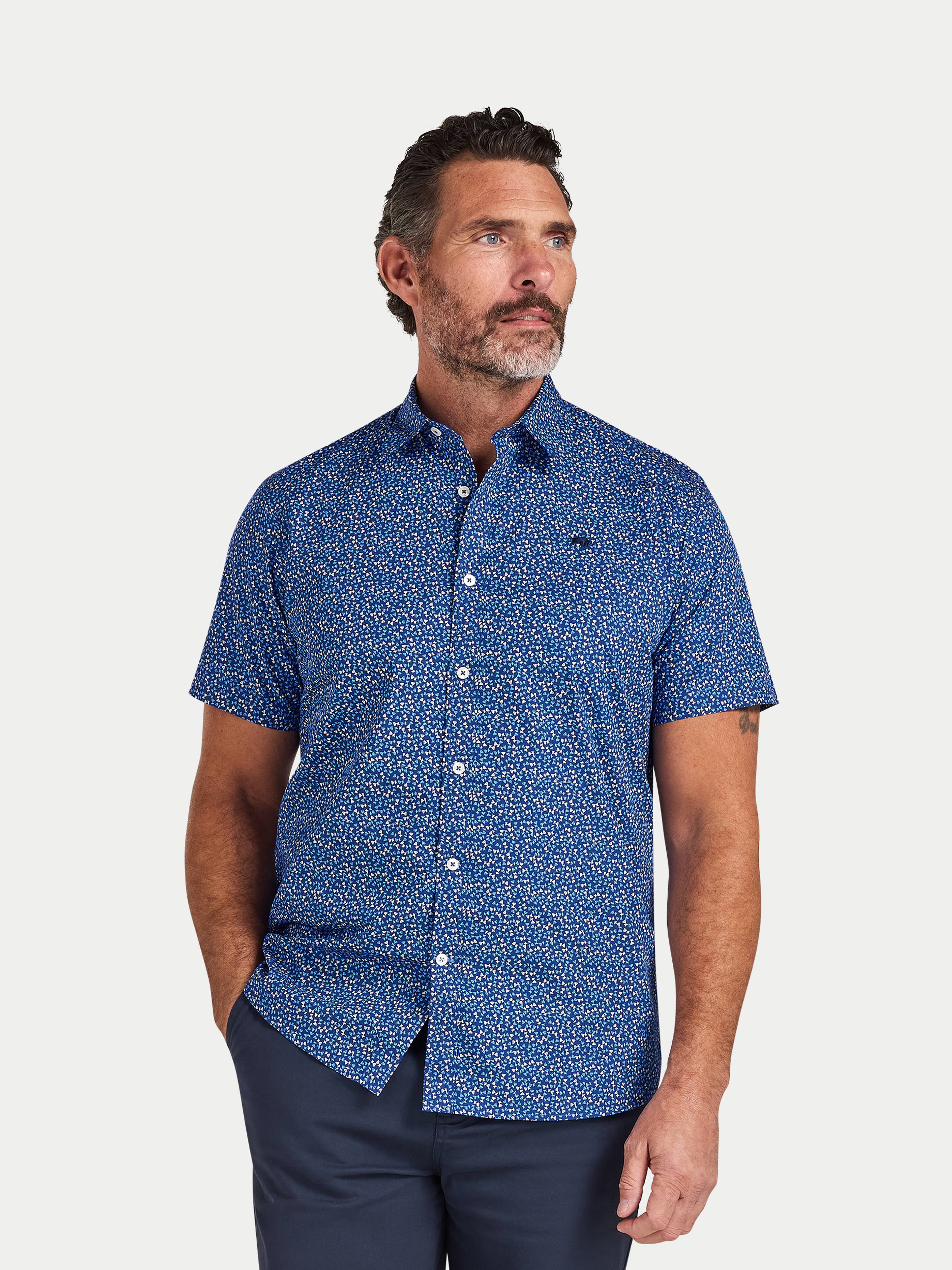Man wearing Raging Bull Flower Bud Cotton Poplin Short Sleeve Shirt in Navy, available in sizes S-6XL.