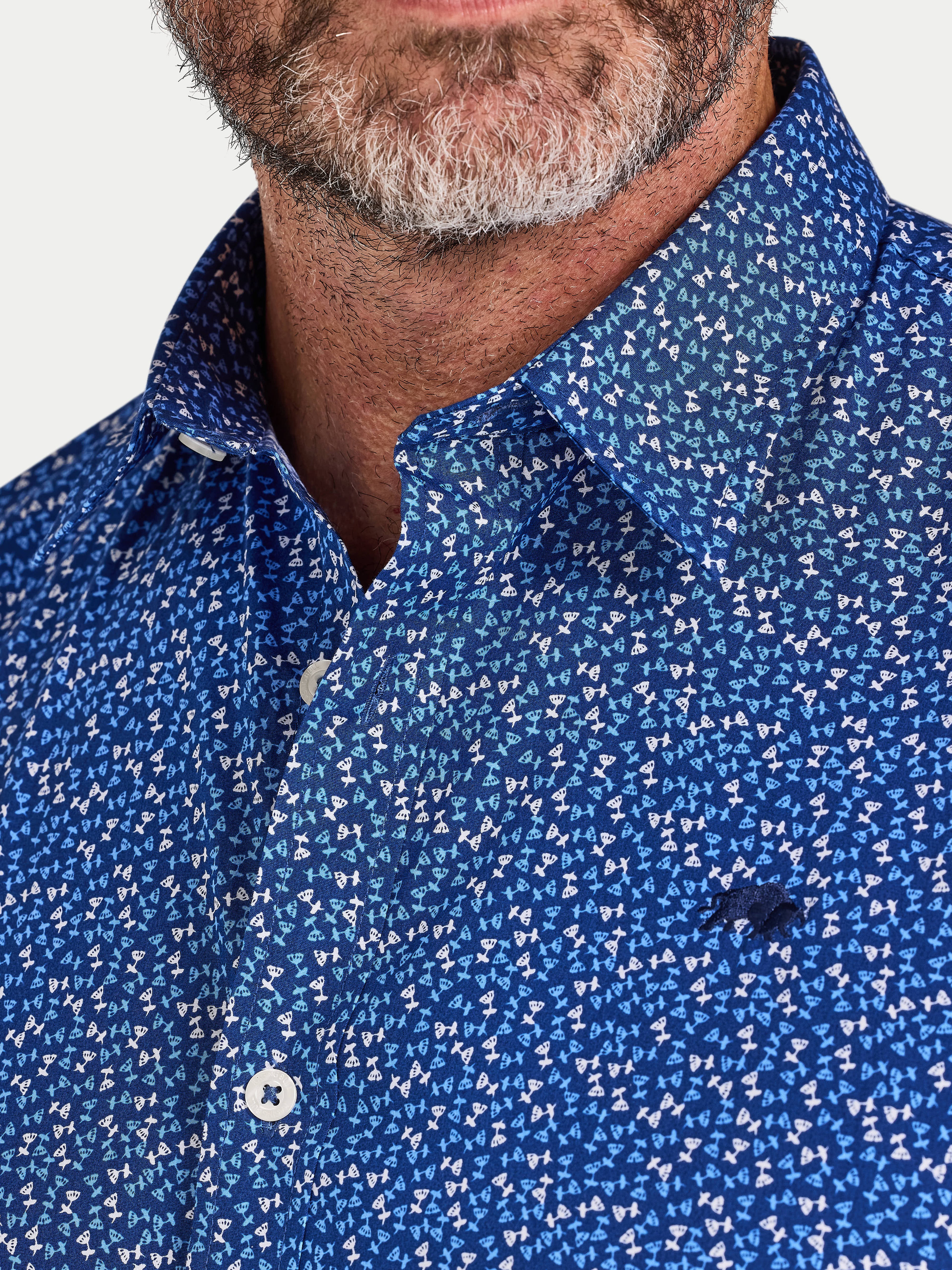 Close-up of a man wearing Raging Bull Flower Bud Cotton Poplin Short Sleeve Shirt in Navy, available in sizes S-6XL.