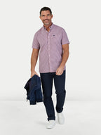 Man wearing Raging Bull Graph Check Poplin Short Sleeve Shirt in Red and Regular Fit Jeans in black, available in sizes S-6XL.
