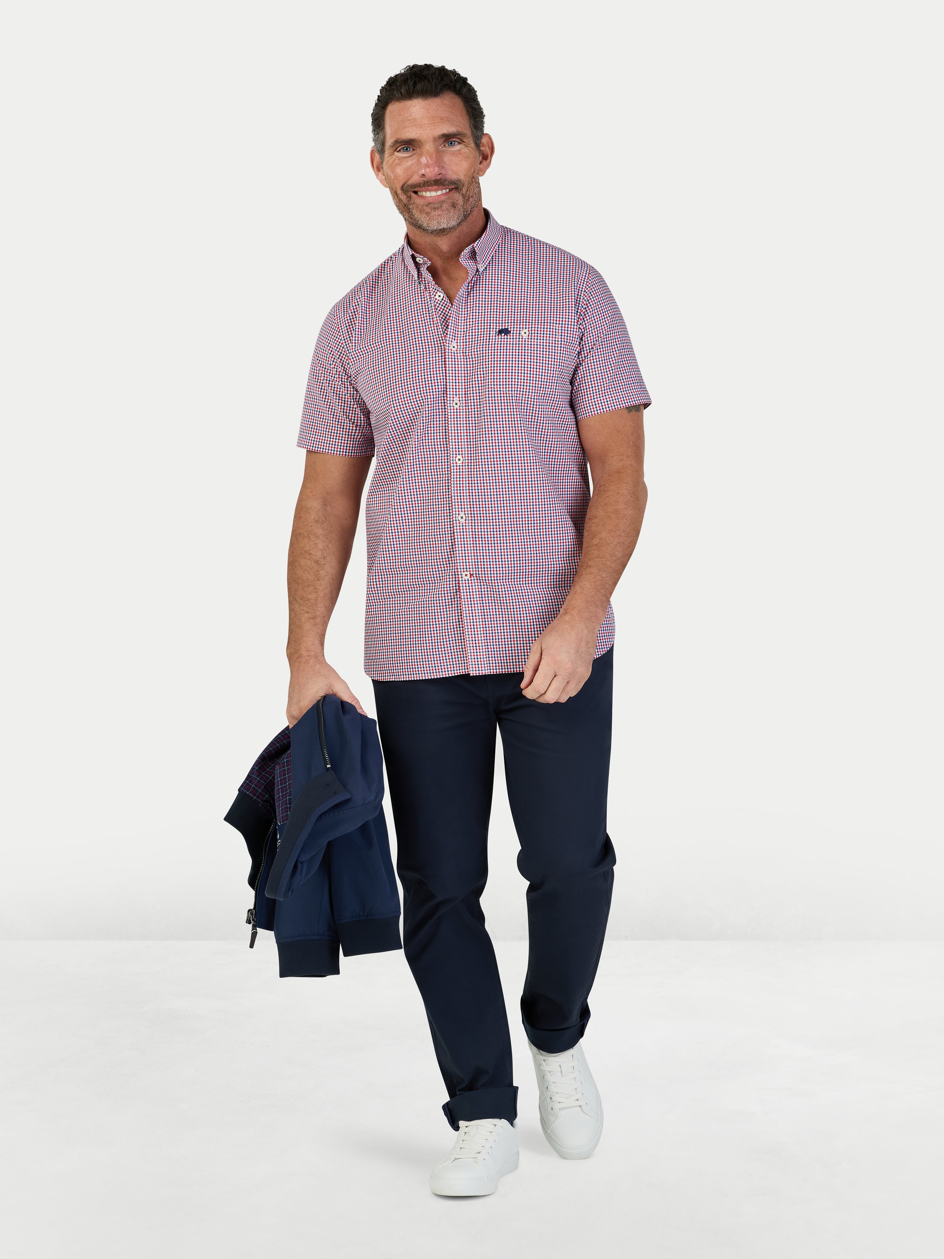 Man wearing Raging Bull Graph Check Poplin Short Sleeve Shirt in Red and Regular Fit Jeans in black, available in sizes S-6XL.