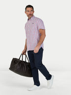 Man wearing Raging Bull Large Check Cotton Poplin Short Sleeve Shirt in Pink and Classic Chino Trousers in navy, available in sizes S-6XL