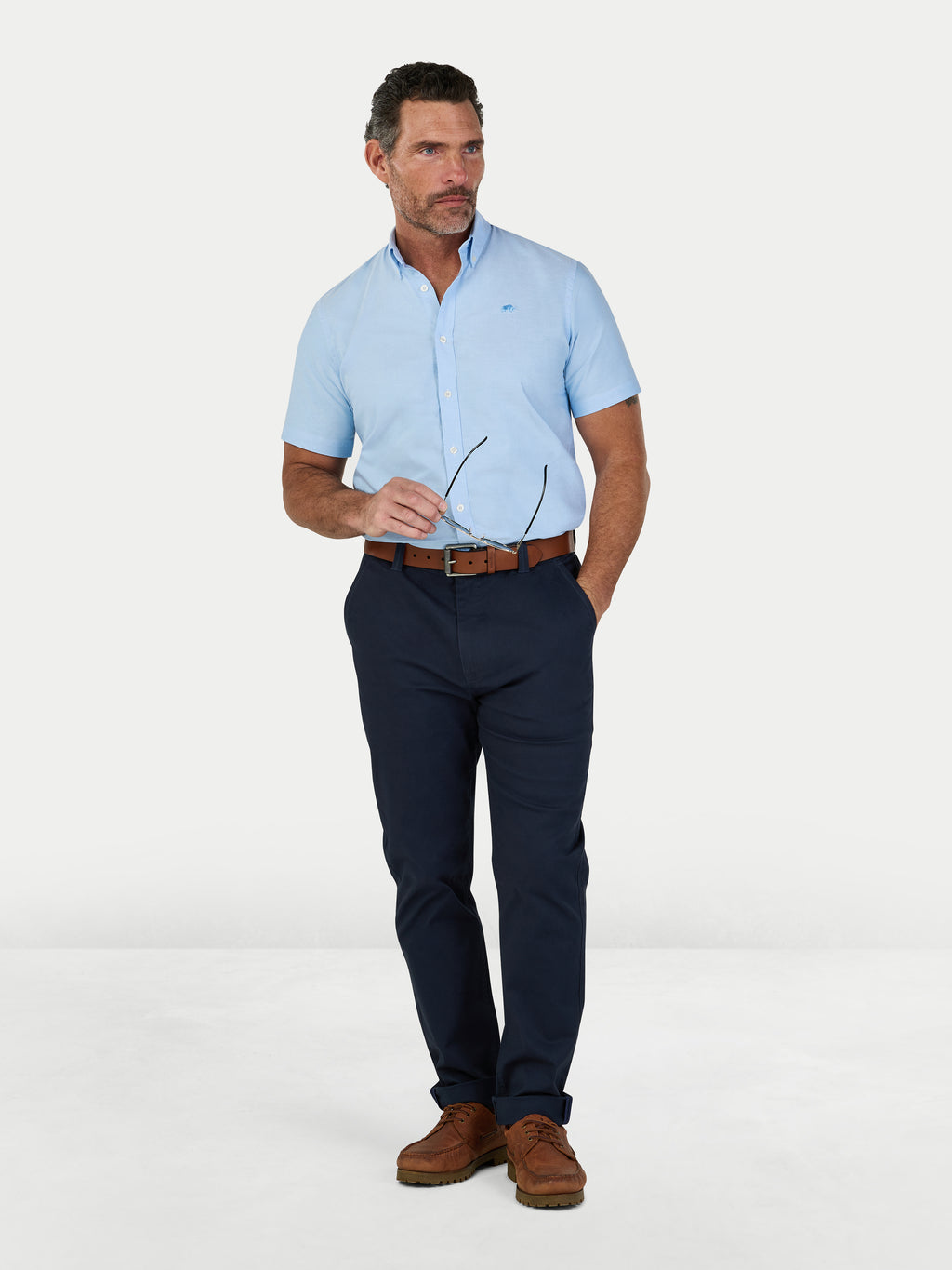 Man wearing Raging Bull Lightweight Oxford Short Sleeve Shirt in Sky Blue, available in sizes S-6XL.