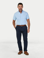 Man wearing Raging Bull Lightweight Oxford Short Sleeve Shirt in Sky Blue and Classic Chino Trousers in navy, available in sizes S-6XL.