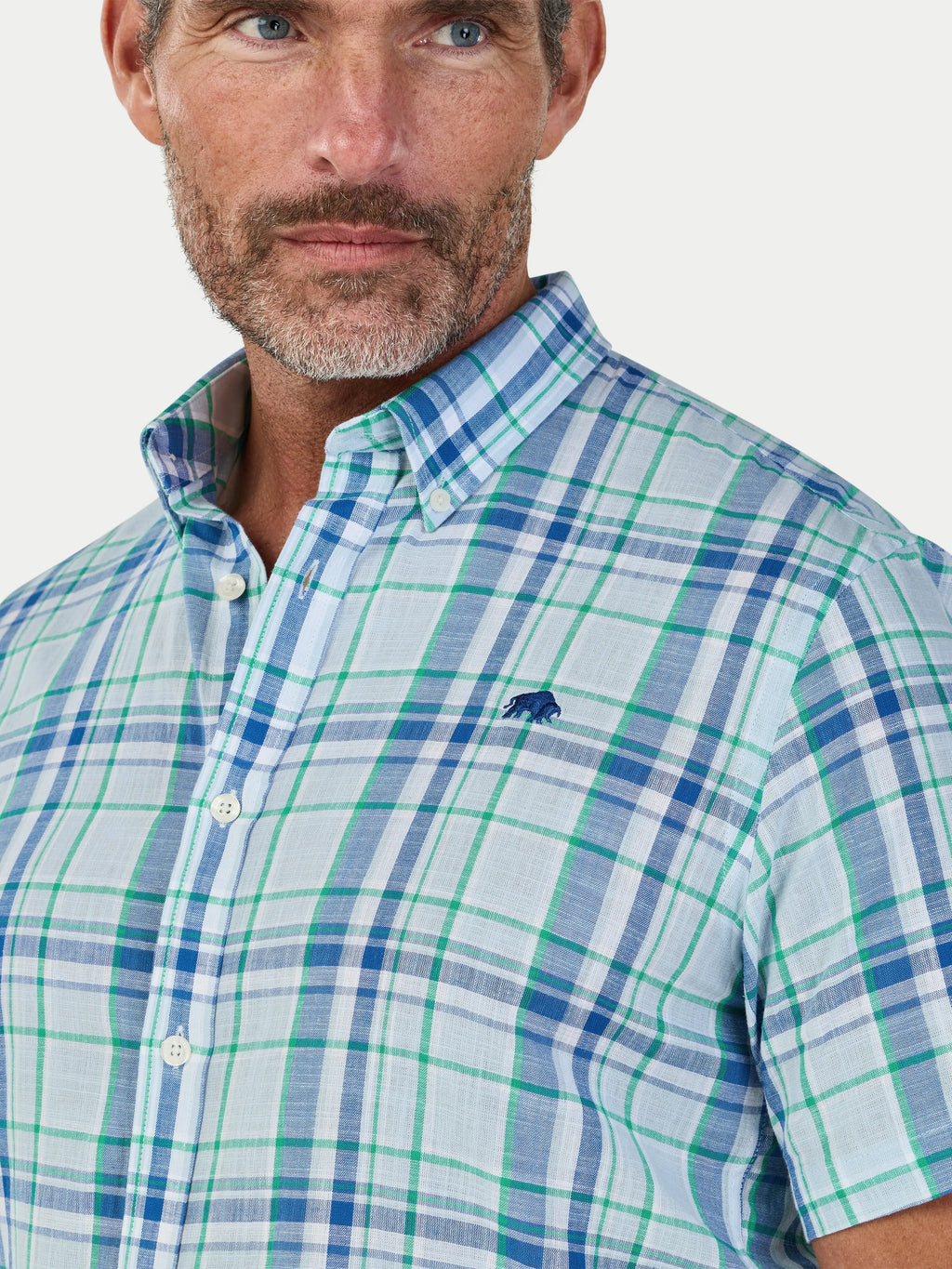 Man wearing Raging Bull Pacific Check Linen Look Short Sleeve Shirt in Sky Blue, chest and collar detail, available in sizes S-6XL.