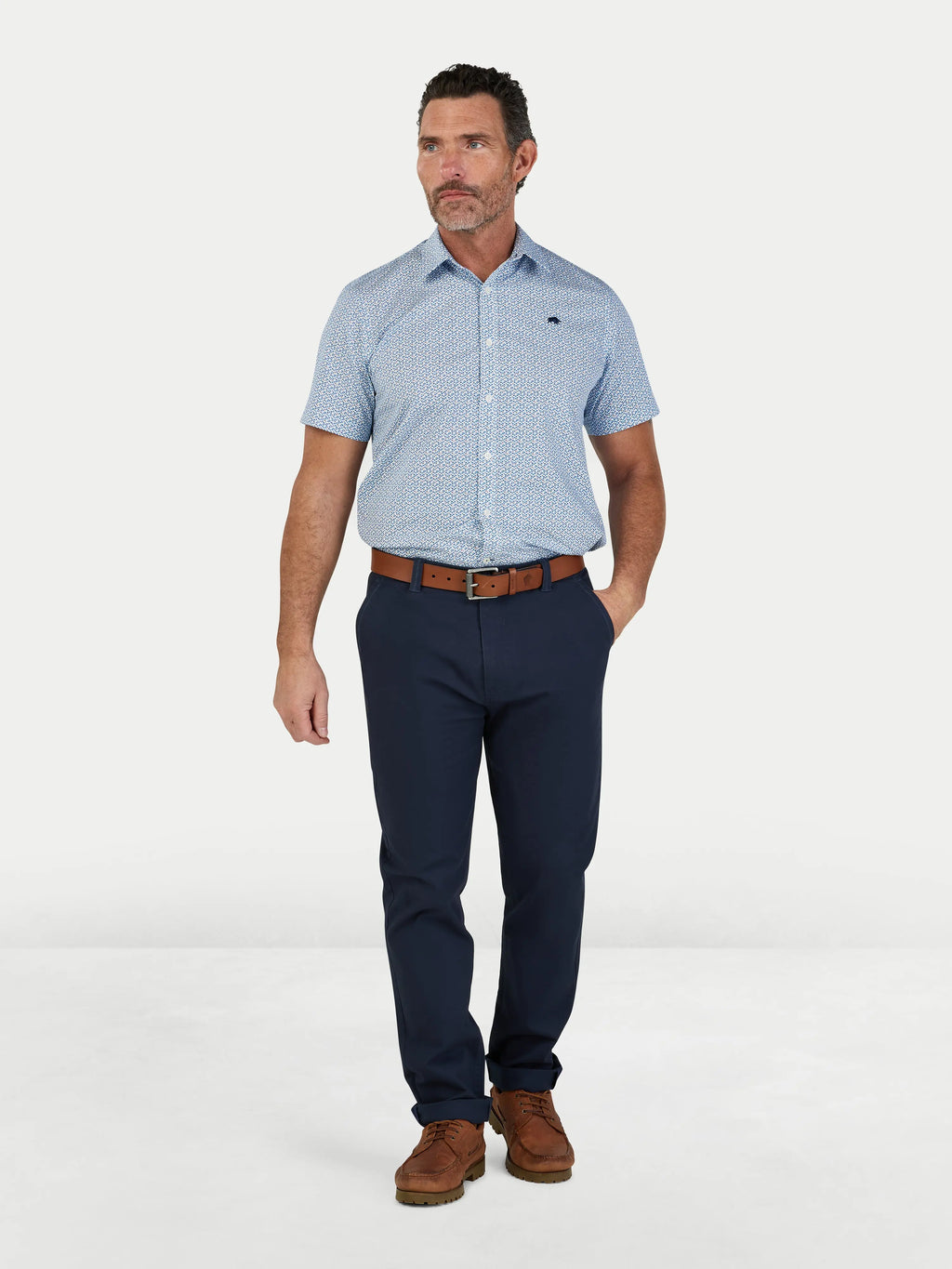 Man wearing Raging Bull Pentagon Pattern Cotton Poplin Short Sleeve Shirt in White and Classic Chino Trouesrs in navy, available in sizes S-6XL