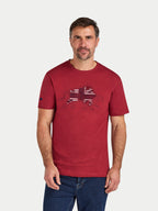 Man wearing a red t-shirt with a graphic design on a white background
