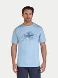 Man wearing a light blue t-shirt with a graphic design on a white background
