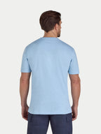 Man wearing a light blue t-shirt on a white background
