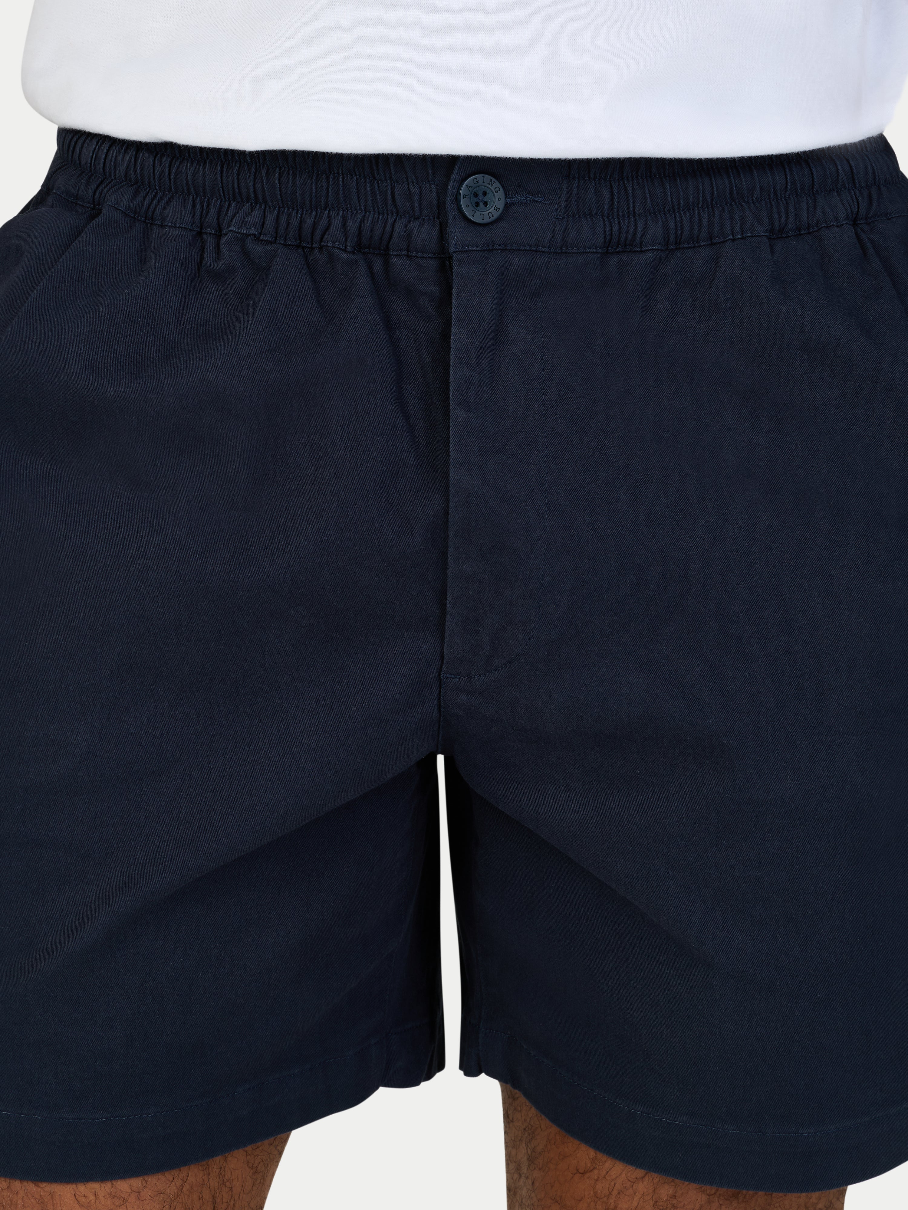 Black shorts with a button on a white background