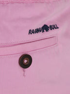 Close-up to the back pocket of the shorts with a Raging Bull logo on top of the pocket. 